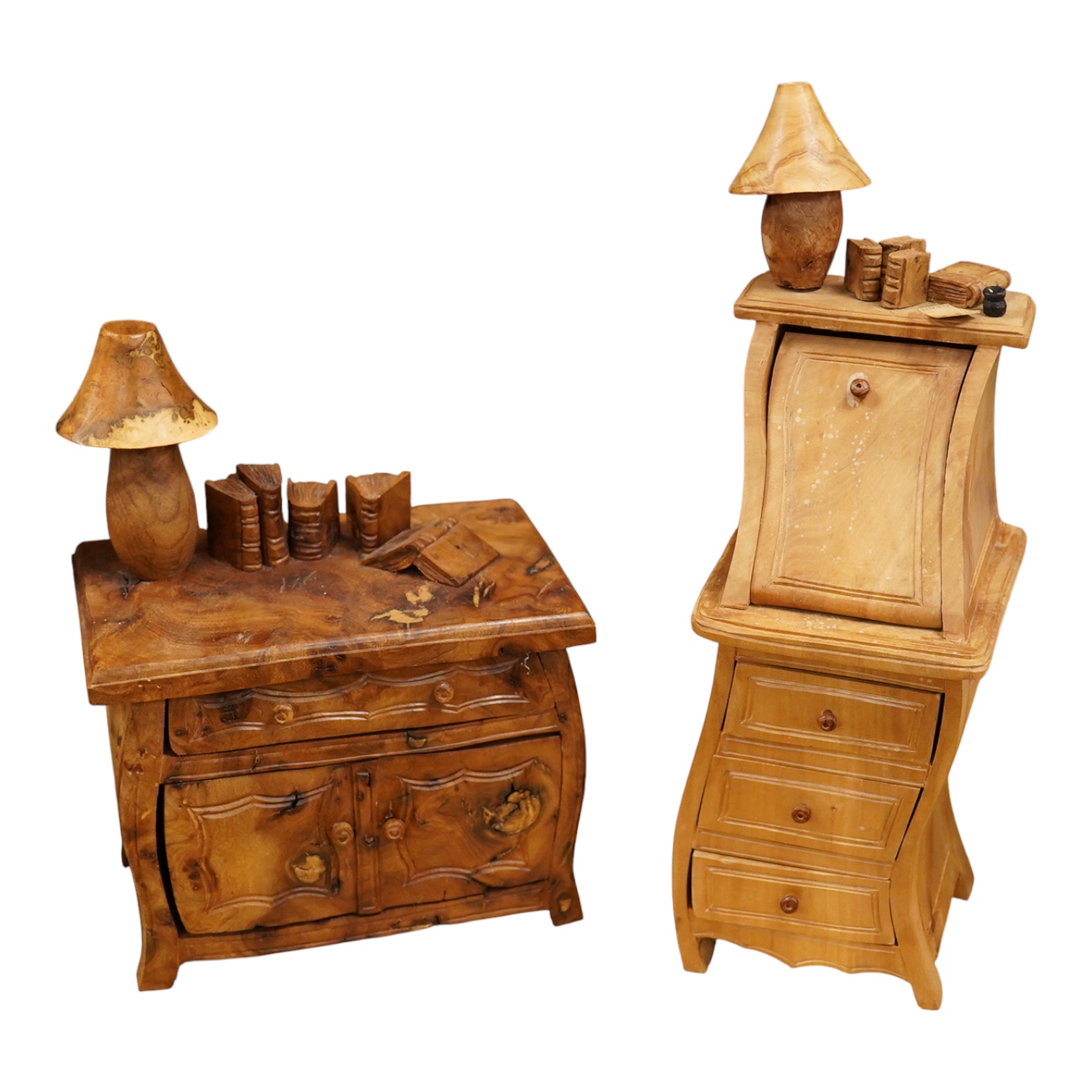 Two Piere Decorse (b.1953), a naturalistically modelled sculpture of a miniature carved novelty bureau and a sideboard, both surmounted with books and a lamp, largest 39cm high
